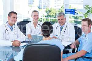 Team of doctors working on laptop