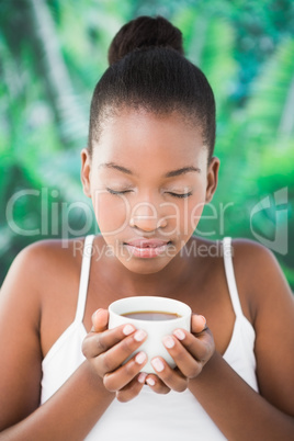 Close up of a beautiful young woman drinking coffee