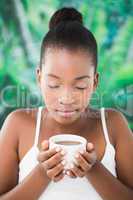 Close up of a beautiful young woman drinking coffee