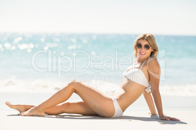 Pretty blonde woman relaxing beside the sea