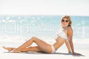 Pretty blonde woman relaxing beside the sea