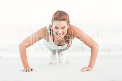 Beautiful brunette doing push ups