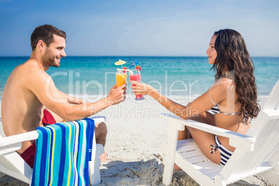 Happy couple drinking a cocktail together