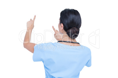 Young nurse in blue tunic gesturing with hands