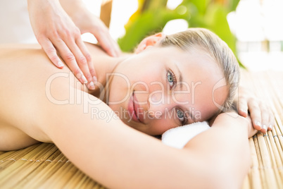 Attractive woman getting massage on her back