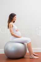 Happy pregnancy sitting on exercice ball