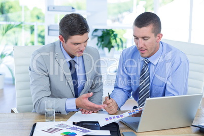 Businessmen in discussion in an office