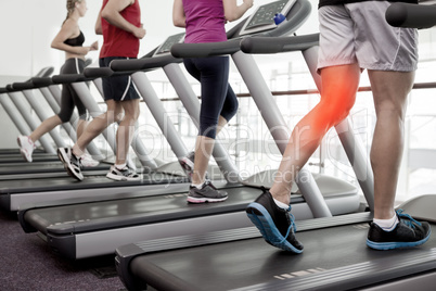 Highlighted knee of man on treadmill