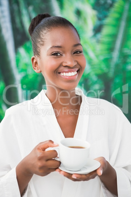 Close up portrait of a beautiful young woman drinking a coffee