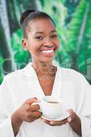 Close up portrait of a beautiful young woman drinking a coffee