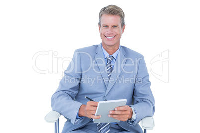 Businessman writing down on a notebook