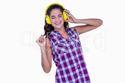 Pretty brunette listening music with headphone