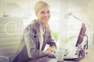 Smiling businesswoman looking at camera