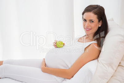 Happy pregnancy with an apple on his belly