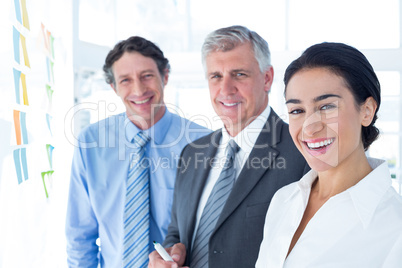 Smiling business people brainstorming together