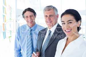 Smiling business people brainstorming together