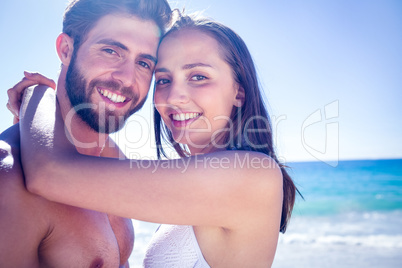 Happy couple hugging and smiling at each other