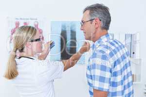 Doctor showing X rays to her patient