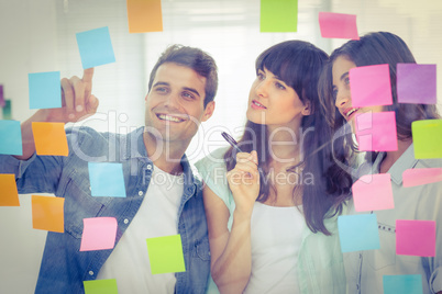 Young creative business people looking at the photo editor