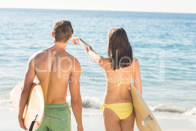 happy couple surfing