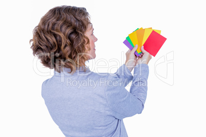 Businesswoman looking at colors cards