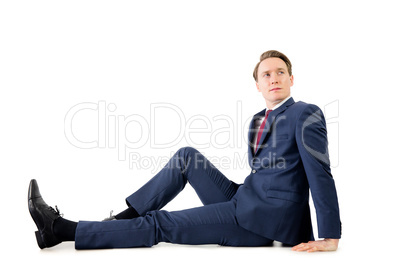 Thoughtful businessman looking away on the floor