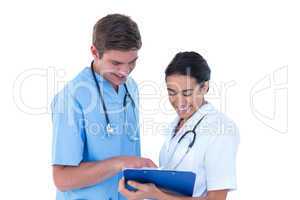 Doctors and nurses discussing over notes