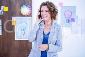 Creative businesswoman having phone call