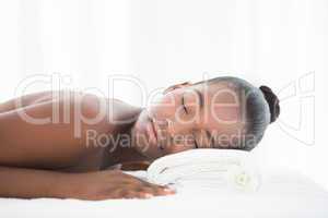 Pretty woman lying on massage table