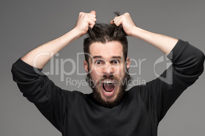 frustration, man tearing hair out in anger