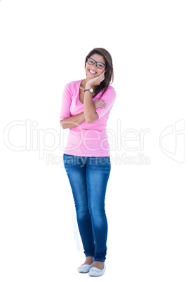Pretty brunette wearing glasses with one hand on chin