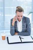 Smiling businesswoman having phone call