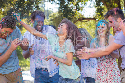 Friends throwing powder paint