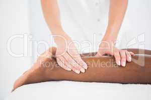 Pretty woman enjoying a leg massage