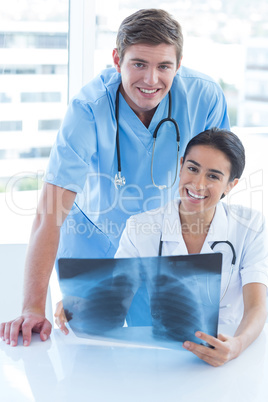 Team of doctors analyzing xray