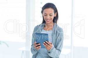 Businesswoman holding a tablet in the office