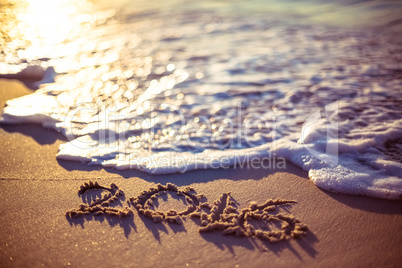 love written on the beach