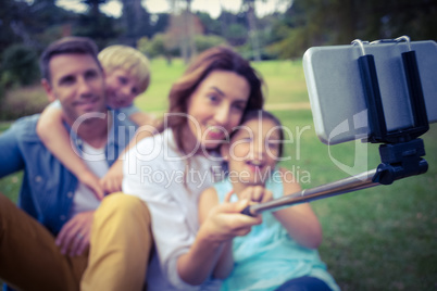 Happy family in the park taking selfie