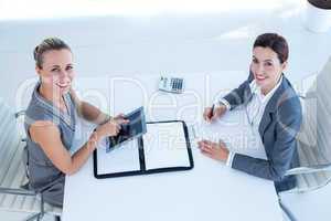 Smiling businesswomen working together