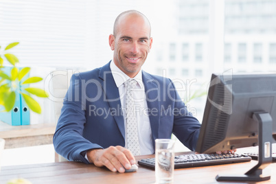 Smiling businessman looking at camera