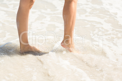 Close up view of woman foot on water