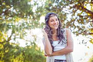 Pretty hipster smiling in the park