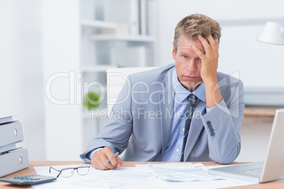 Businessman with his hand on his forehead