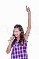 Happy pretty brunette singing on microphone