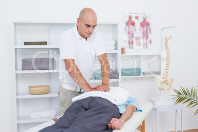 Physiotherapist doing back massage