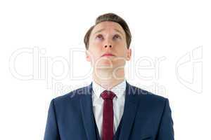 Serious businessman looking at top