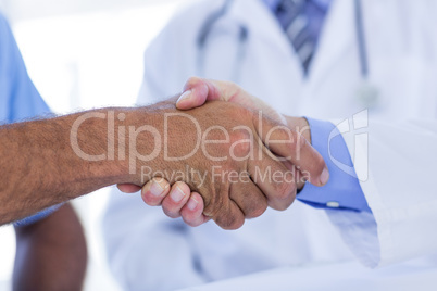 Doctors doing hands shakes
