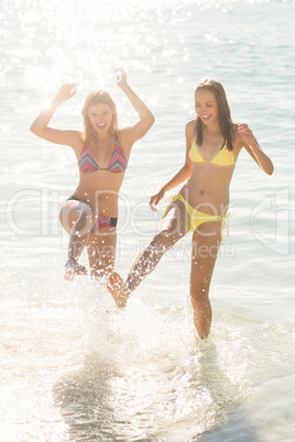 Happy friends having fun in the water together