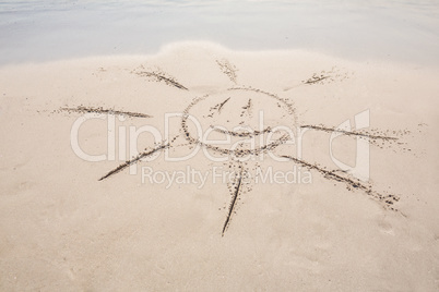 drawing of a sun in the sand