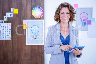 Creative businesswoman using tablet computer